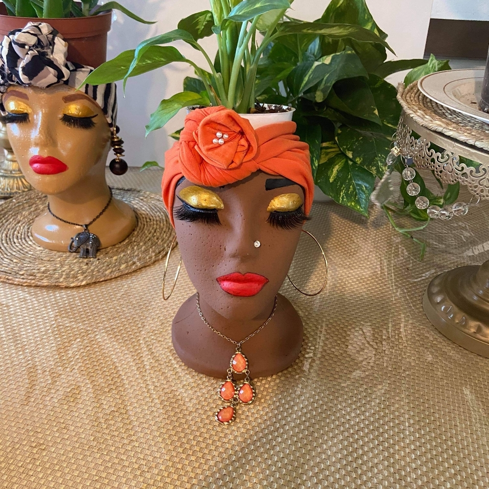 Doll head plant holders